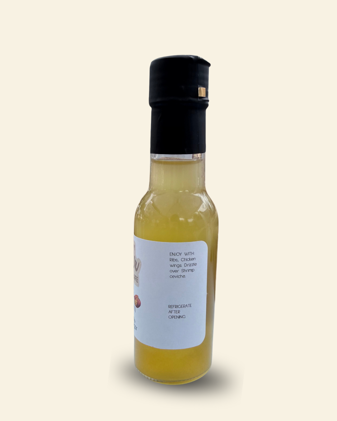 A 3 fl oz bottle of Cozy Pear Cafe Sol Spice Infused White Balsamic Vinegar, featuring a white label with brown script lettering and a black cap, set against a solid cream background.