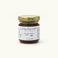 Cozy Pear Cafe Meridian Amber fruit jam in a small 1.5 oz glass jar with a gold lid on a white background.